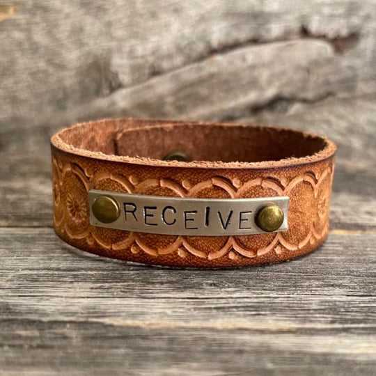 Genuine leather, hand-tooled bracelet with motivational word