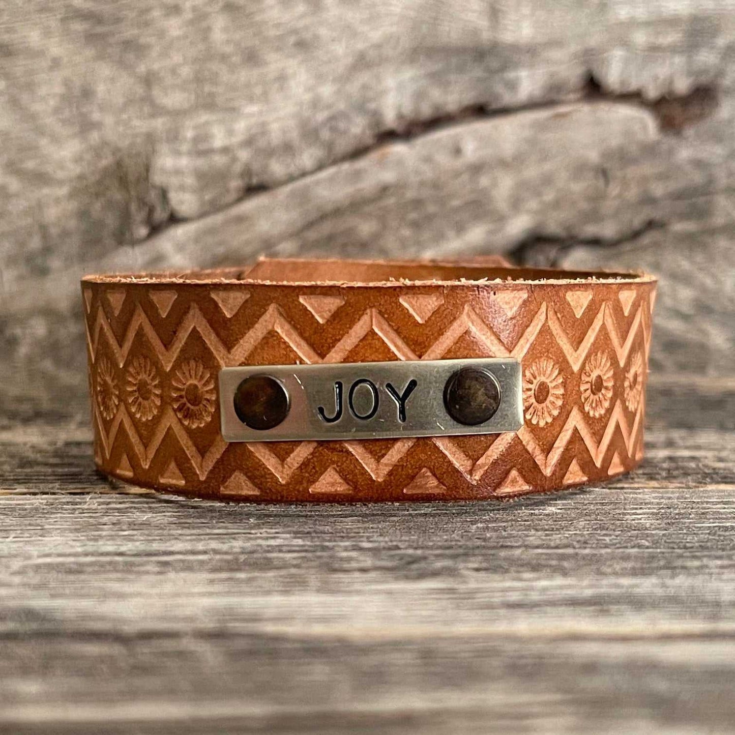 Genuine leather, hand-tooled bracelet with motivational word