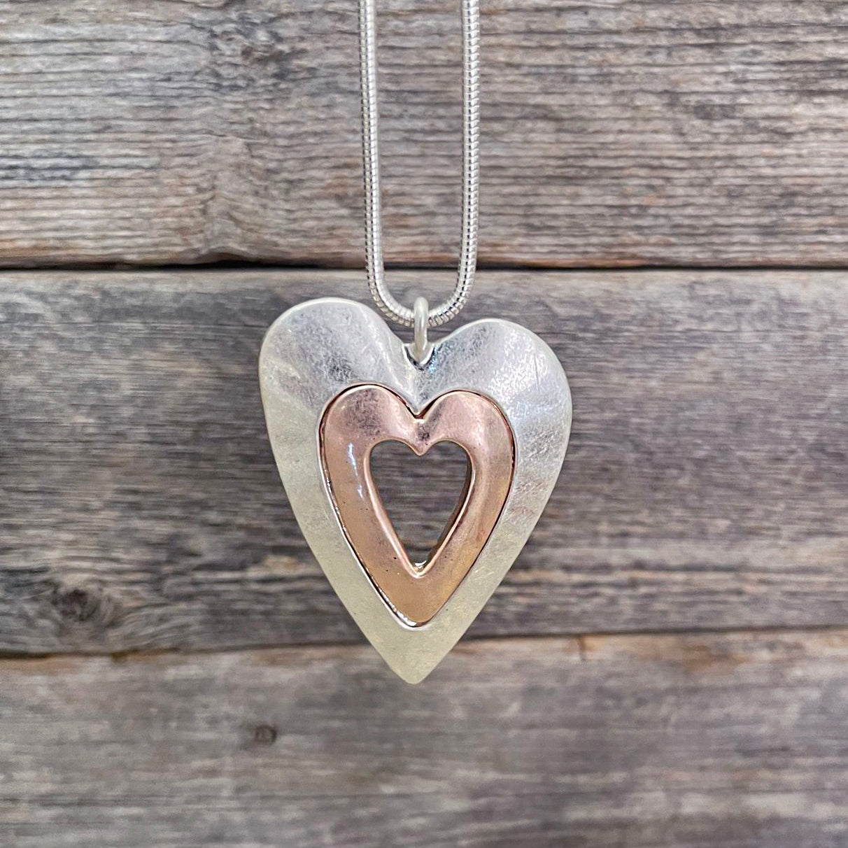 Two-tone, metal heart pendant necklace