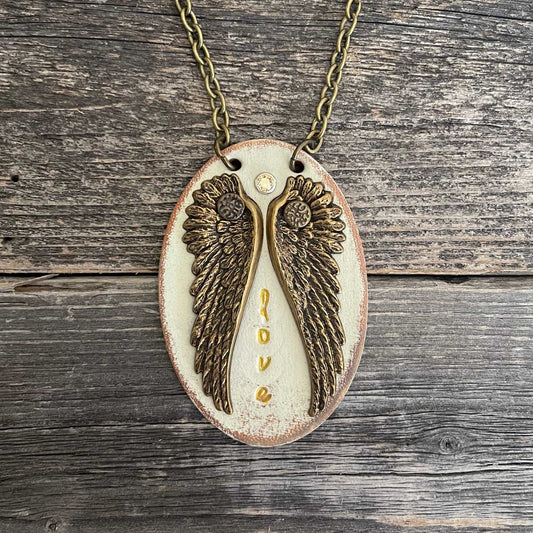 Unique, one of a kind leather pendant necklace with wing design