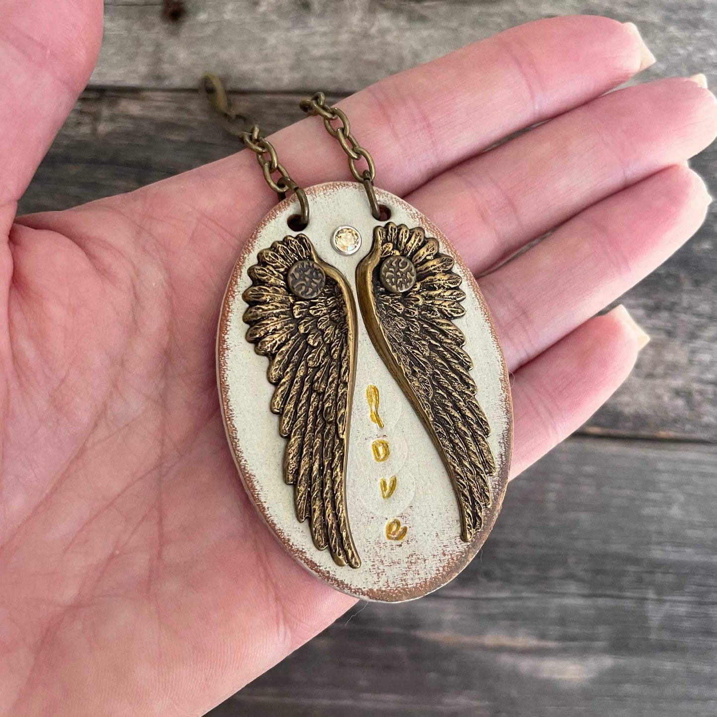 Unique, one of a kind leather pendant necklace with wing design