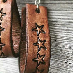 Genuine leather drop earrings with tooled stars design