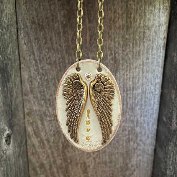 Unique, one of a kind leather pendant necklace with wing design